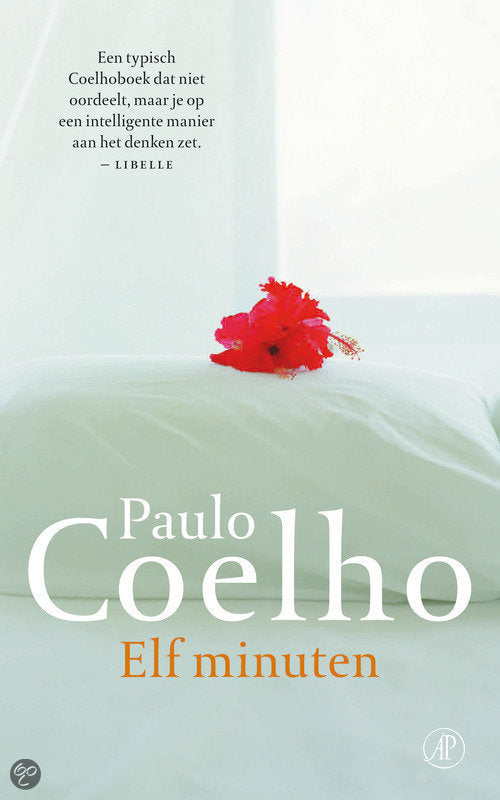 Zijaanzicht van het boek Elf Minuten met zichtbare ruggengraat en pagina's van De Paarse Keizerin uitgeverij