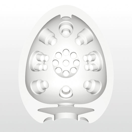 Doorsnede van de Tenga Egg Clicker met interne structuur van ronde nokjes en gaatjes