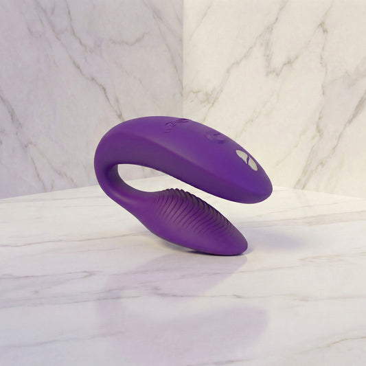 We-Vibe Sync 2 roze koppelvibrator vooraanzicht op witte achtergrond